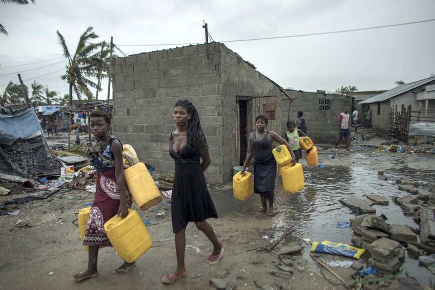 epa07447957 A handout photo made available by CARE, an international humanitarian agency shows local residents in search of clean water after cyclone Idai made landfall in Sofala Province, Central Moz ...