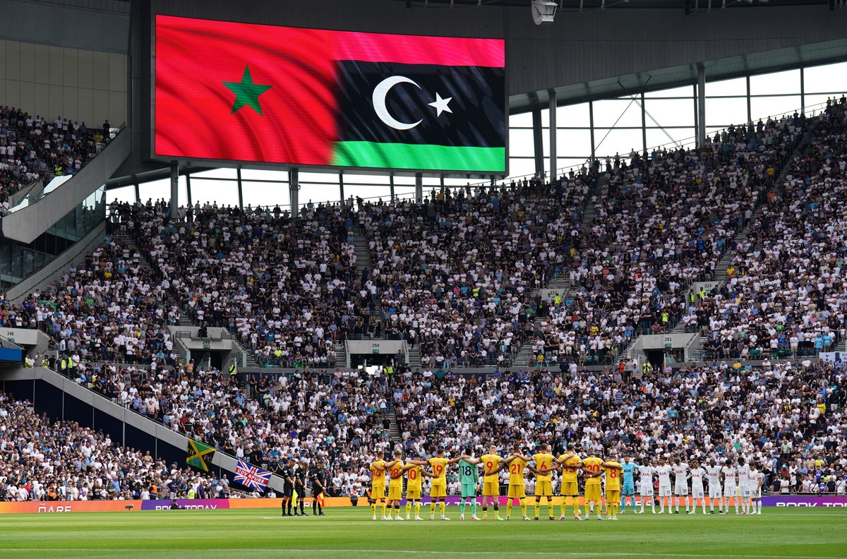The players and fans observe a minute's silence for the natural disasters in Morocco and Libya this month before the Premier League match at the Tottenham Hotspur Stadium, London. Picture date: S ...