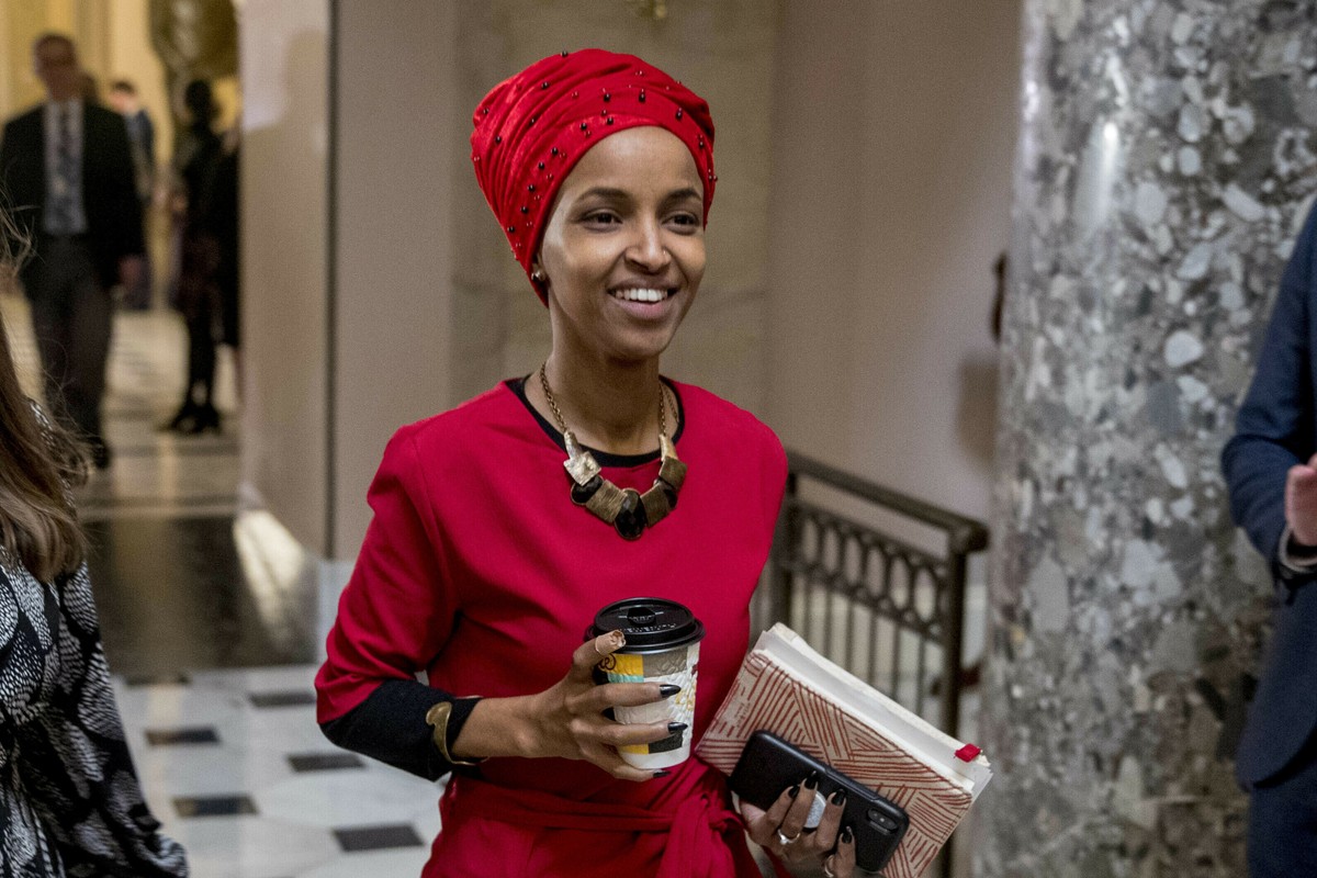 FILE - In this Jan. 16, 2019 file photo, Rep. Ilhan Omar, D-Minn., walks through the halls of the Capitol Building in Washington. In Omar's Minnesota district, both Jews and Muslims voiced concer ...