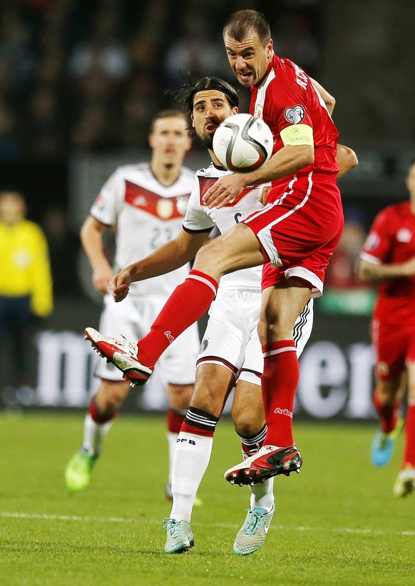 Germany&#039;s Sami Khedira, left, and Roy Chipolina challenge for the ball during a Group D Euro 2016 qualifying match between Germany and Gibraltar in Nuremberg, Germany, Friday, Nov. 14, 2014. (AP  ...