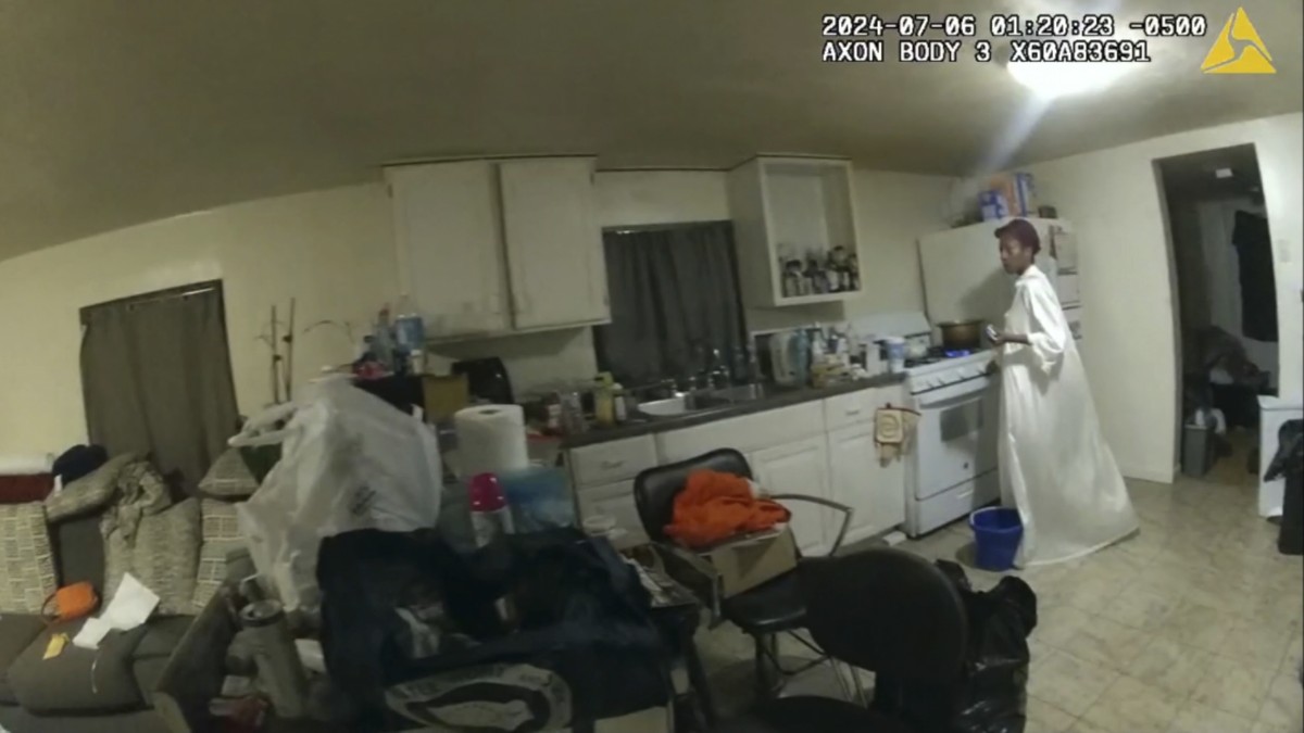 In this image taken from body camera video released by Illinois State Police on Monday, July 22, 2024, Sonya Massey, who called 911 for help, stands near her kitchen stove before being shot in the fac ...