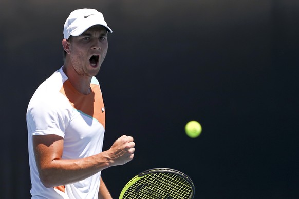 Miomir Kecmanovic of Serbia reacts during his third round match against Lorenzo Sonego of Italy at the Australian Open tennis championships in Melbourne, Australia, Friday, Jan. 21, 2022. (AP Photo/Te ...