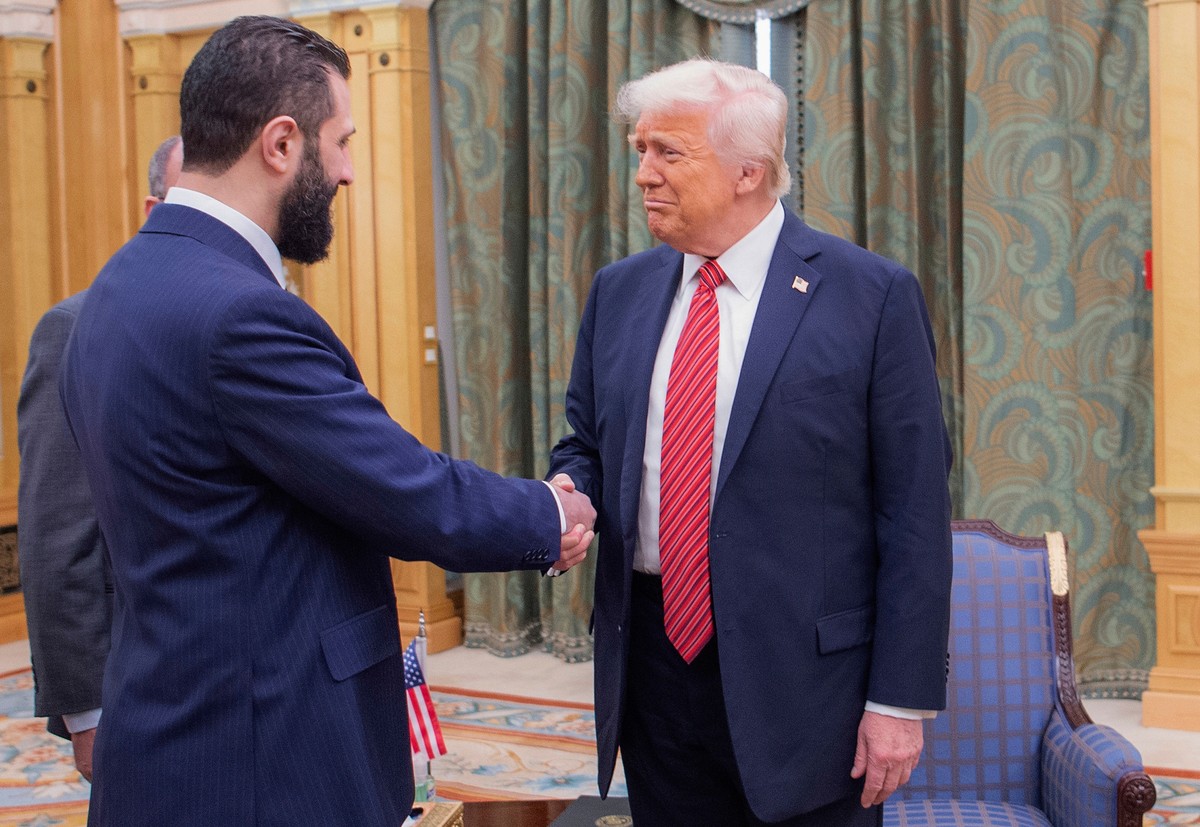 FILE - In this photo released by the Saudi Royal Palace, President Donald Trump, right, shakes hands with Syria's interim President Ahmad al-Sharaa in Riyadh, Saudi Arabia, May 14, 2025. (Bandar  ...