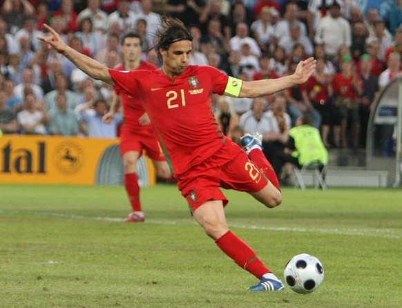 epa01388908 Portuguese Nuno Gomes sets up the 2-1 during the EURO 2008 Quarter Final match between Portugal and Germany at the St Jakob Park stadium, Basel, Switzerland 19 June 2008. EPA/SRDJAN SUKI + ...