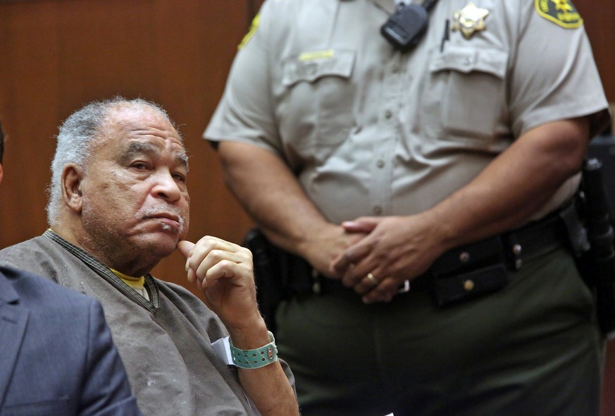 Samuel Little listens as he is sentenced to three consecutive terms of life in prison without parole for murdering three women in the late 1980s, in a Los Angeles courtroom Thursday, Sept. 25, 2014. L ...