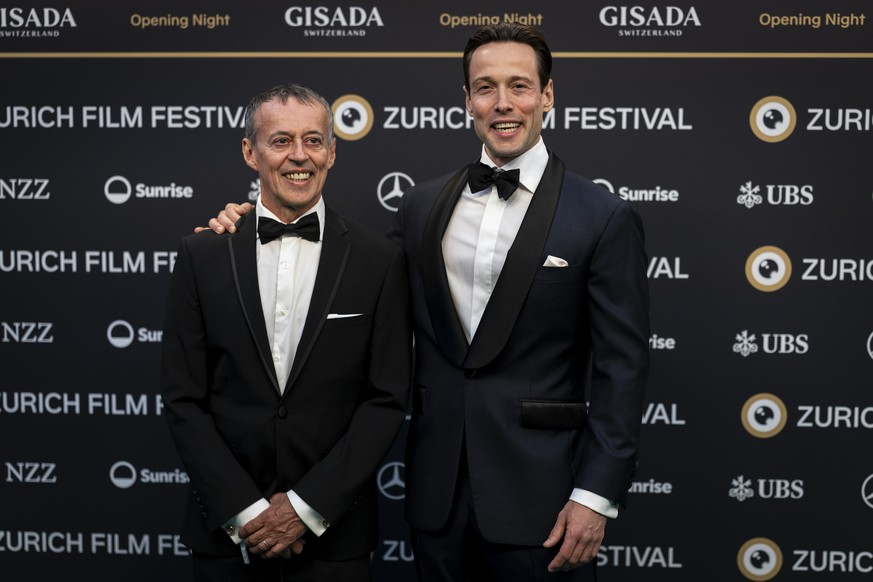 Internet fenomen Roman Poole aka. "Finance guy", right, poses with a guest on the Green Carpet during the Opening Night of the 22nd Zurich Film Festival (ZFF) in the Zurich Convention Center ...