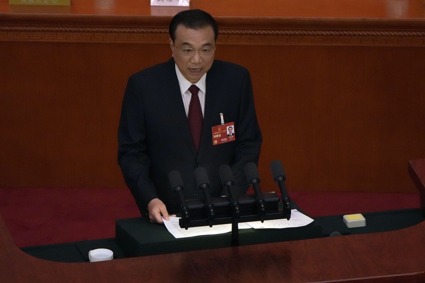 Chinese Premier Li Keqiang speaks during the opening session of China&#039;s National People&#039;s Congress (NPC) at the Great Hall of the People in Beijing, Sunday, March 5, 2023. (AP Photo/Ng Han G ...