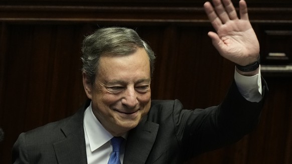 Italian Premier Mario Draghi waves to lawmakers at the end of his address at the Parliament in Rome, Thursday, July 21, 2022. Premier Mario Draghi&#039;s national unity government headed for collapse  ...