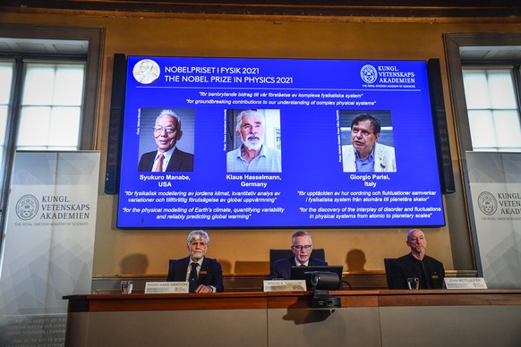 epa09506747 (L-R) Member of the Nobel Committee for Physics Thors Hans Hansson, Goran K. Hansson, Secretary General of the Royal Swedish Academy of Sciences, and Member of the Nobel Committee for Phys ...