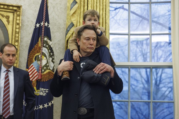epa11889342 US entrepreneur and U.S. special government employee Elon Musk, with his son X, gives remarks to the media in the Oval Office of the White House, as he meets with US President Donald J. Tr ...