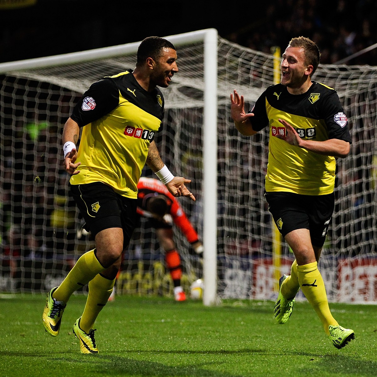 WATFORD, ENGLAND - APRIL 08: Almen Abdi of Watford (R) cekebrates scoring the opening goal of the game during the Sky Bet Championship match between Watford and Leeds United at Vicarage Road on April  ...