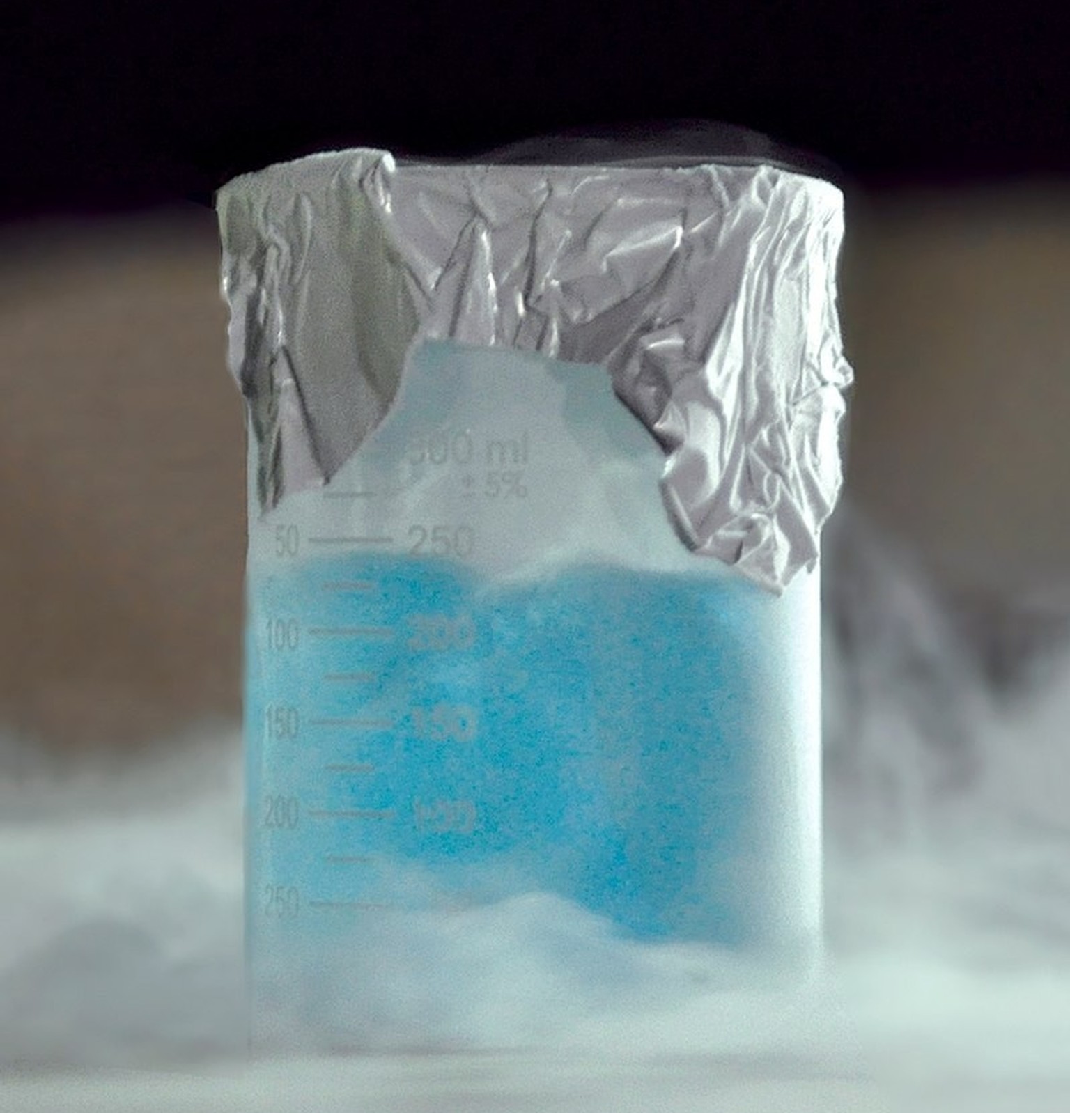 Liquid oxygen (pale cyan liquid) in a beaker.  https://en.wikipedia.org/wiki/Liquid_oxygen#/media/File:Liquid_oxygen_in_a_beaker_(cropped_and_retouched).jpg