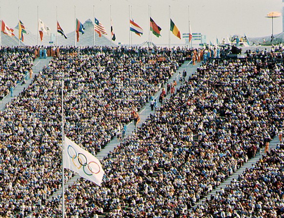 The Olympic flag, foreground, and flags of participating nations are flown at half-staff during a commemoration ceremony for the victims of the Munich Olympic massacre at the Munich, southern Germany, ...