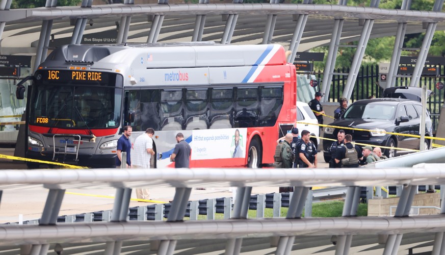 epaselect epa09392263 Police and officials work at the scene of a shooting in the Metro bus station outside the Pentagon in Arlington, Virginia, USA, 03 August 2021. Multiple people have been reported ...