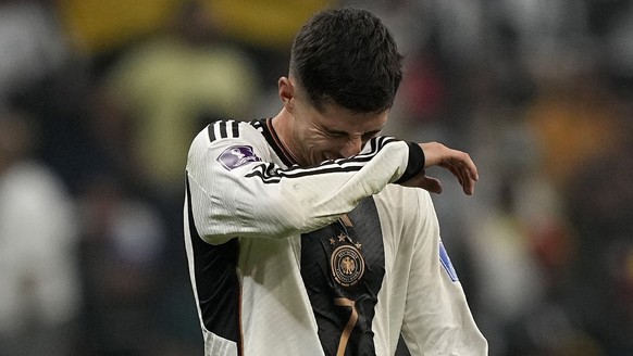 Germany's Kai Havertz, left, and Germany's Mario Goetze react after the World Cup group E soccer match between Costa Rica and Germany at the Al Bayt Stadium in Al Khor , Qatar, Thursday, Dec ...
