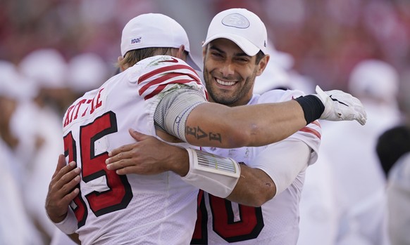 San Francisco 49ers quarterback Jimmy Garoppolo embraces tight end George Kittle at the end of an NFL football game against the Carolina Panthers in Santa Clara, Calif., Sunday, Oct. 27, 2019. San Fra ...