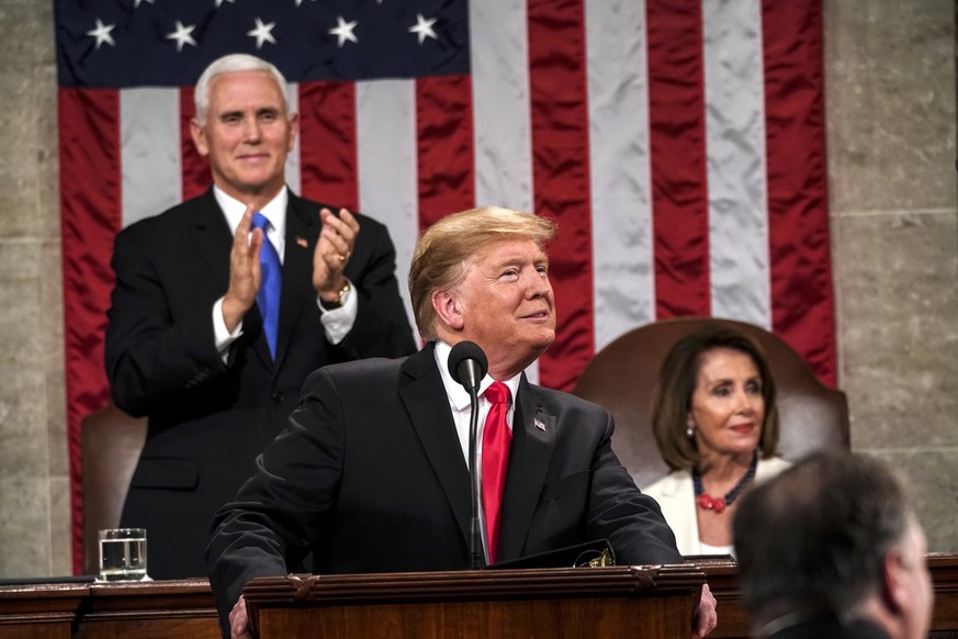 epa07346740 US President Donald J. Trump (C) delivers the State of the Union address with Vice President Mike Pence and Speaker of the House Nancy Pelosi at the Capitol in Washington, DC, USA, 05 Febr ...