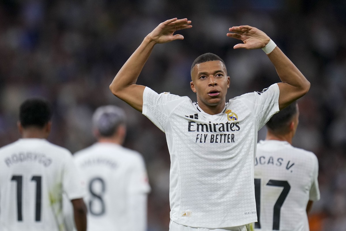 Real Madrid's Kylian Mbappe celebrates after scoring his side's second goal during a Spanish La Liga soccer match between Real Madrid and Alaves at Santiago Bernabeu stadium in Madrid, Spain ...