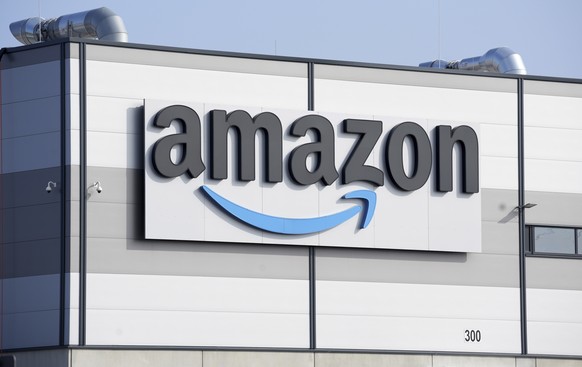 FILE - An Amazon company logo marks the facade of a building, March 18, 2022, in Schoenefeld near Berlin. Companies make it easy to subscribe to their services ? and frustratingly hard to unsubscribe. ...