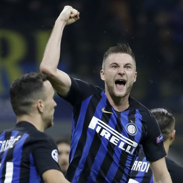 Inter defender Milan Skriniar, center, celebrates after his teammate Inter forward Mauro Icardi, scored his side&#039;s opening goal during the Champions League group B soccer match between Inter Mila ...