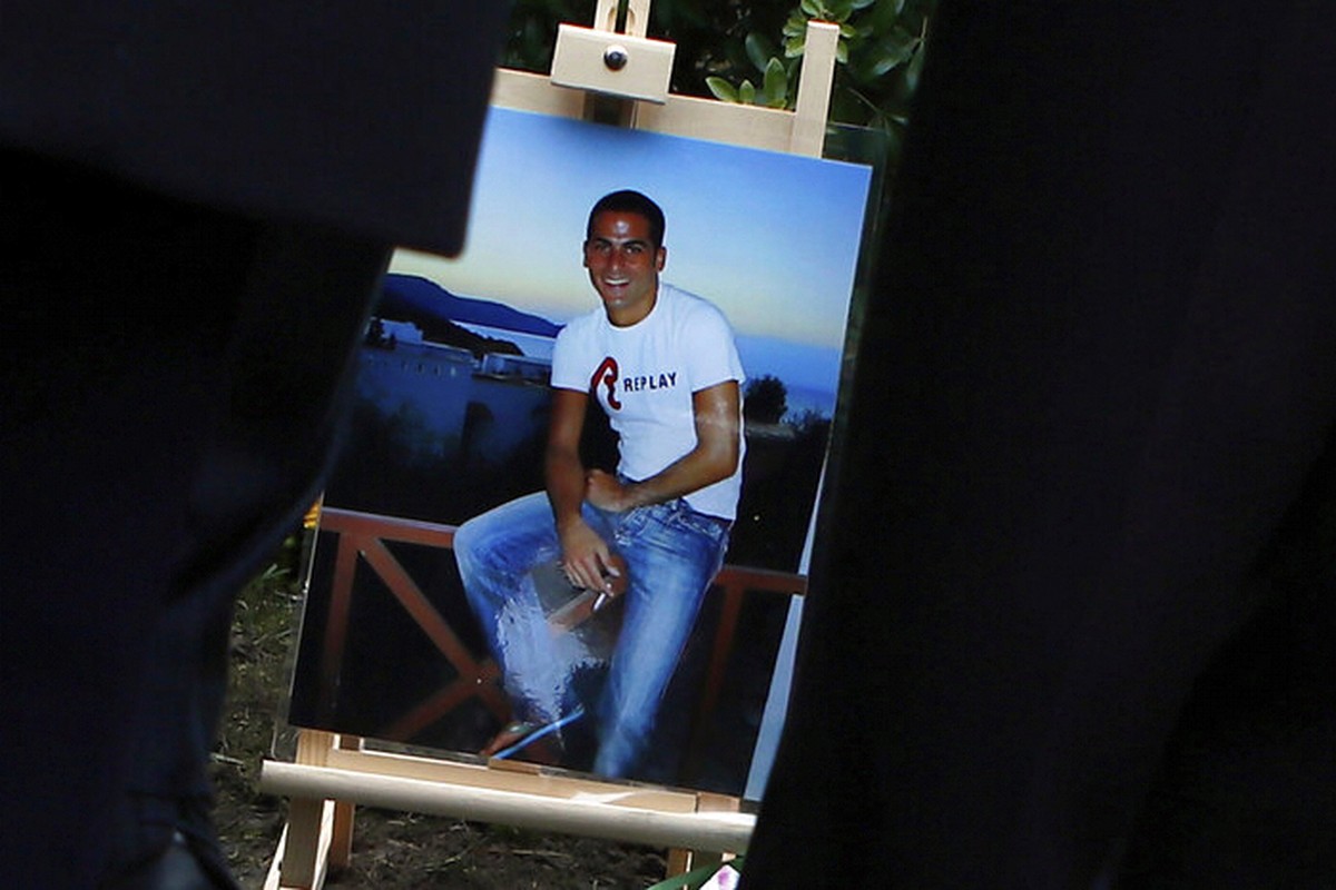 FILE - A picture of Ilan Halimi is seen at a makeshift memorial, in Sainte Genevieve des Bois, south suburb of Paris, Wednesday, Feb. 13, 2019 during a tribute ceremony (AP Photo/Francois Mori, File)
 ...
