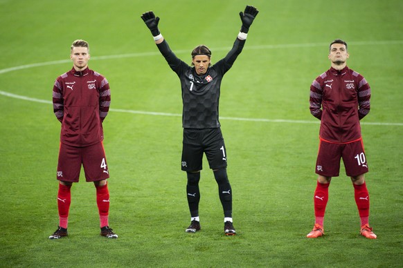 Switzerland&#039;s defender Nico Elvedi, left, Switzerland&#039;s goalkeeper Yann Sommer, center, and Switzerland&#039;s midfielder Granit Xhaka, right, react during the UEFA Nations League group 4 so ...