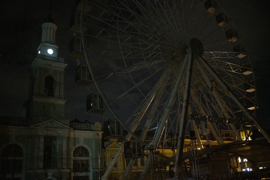 City lighting turned off at twilight in Kyiv downtown, Ukraine, Monday, Oct. 31, 2022. Rolling blackouts are increasing across Ukraine as the government rushes to stabilise the energy grid and repair  ...