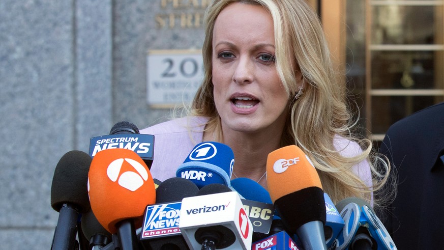 FILE - In this April 16, 2018, file photo, adult film actress Stormy Daniels speaks outside federal court in New York. A federal judge is set to hear arguments about whether to delay the case of Danie ...