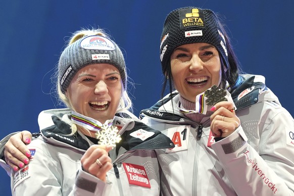 Austria's Katharina Truppe, left, and Austria's Stephanie Venier show their bronze medal in a women's team combined event, at the Alpine Ski World Championships, in Saalbach-Hinterglemm ...