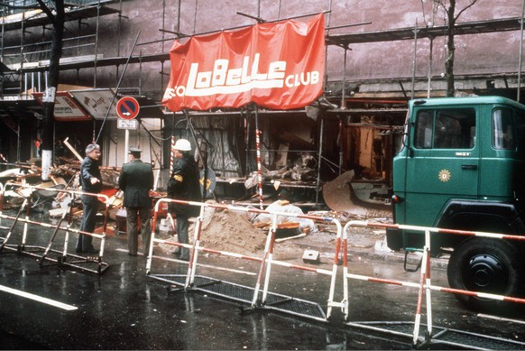 Police investigators in this 05 April 1986 file picture stand in front of the damaged entrance of the &quot;La Belle&quot; discothek in Berlin, after the club - mainly frequented by US soldiers - was  ...