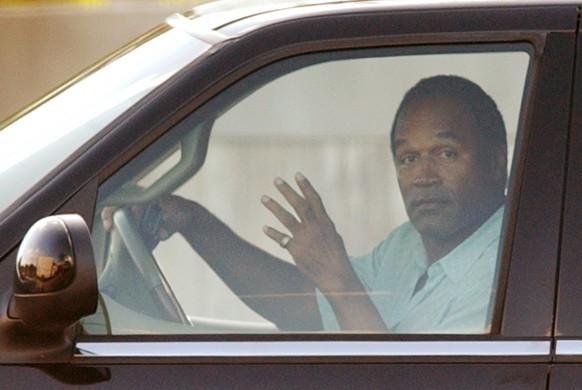 O. J. Simpson leaves his home Tuesday, Dec. 4, 2001 in the Kendal neighborhood of Miami. Authorities searched Simpson&#039;s home for more than six hours as part of an investigation into an Ecstasy dr ...