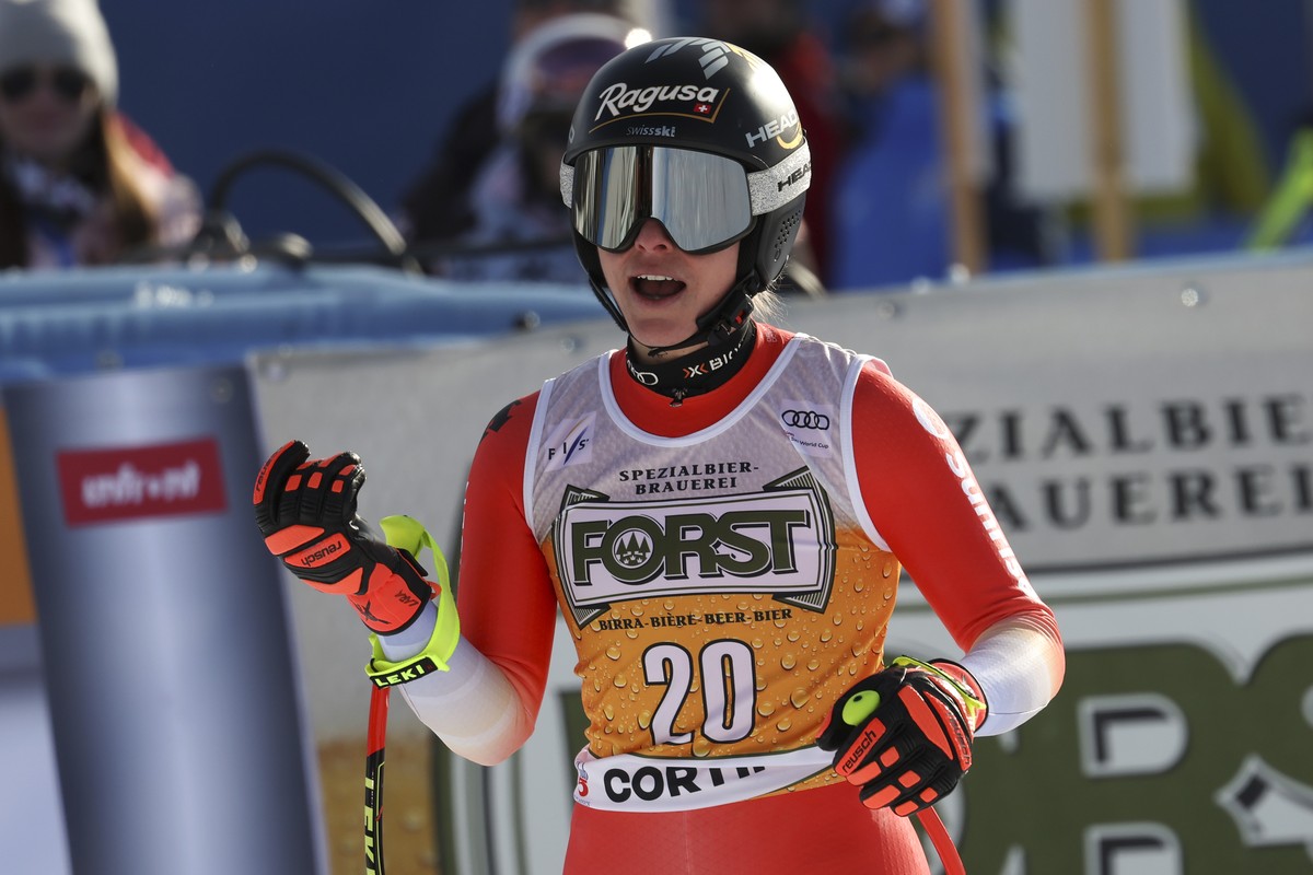 Switzerland's Lara Gut Behrami celebrates at the finish area of an alpine ski, women's World Cup downhill race, in Cortina d'Ampezzo, Italy, Saturday, Jan. 21, 2023. (AP Photo/Alessandr ...