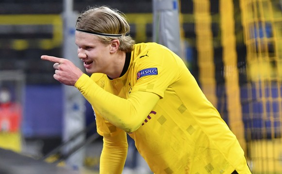 Dortmund&#039;s Erling Haaland celebrates after scoring his sides first goal during the Champions League, round of 16, second leg soccer match between Borussia Dortmund and Sevilla FC in Dortmund, Ger ...