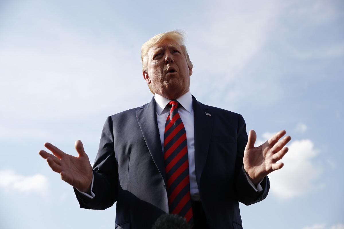 President Donald Trump speaks with reporters before boarding Air Force One with first lady Melania Trump at Morristown Municipal Airport in Morristown, N.J., Sunday, Aug. 18, 2019, en route to Andrews ...