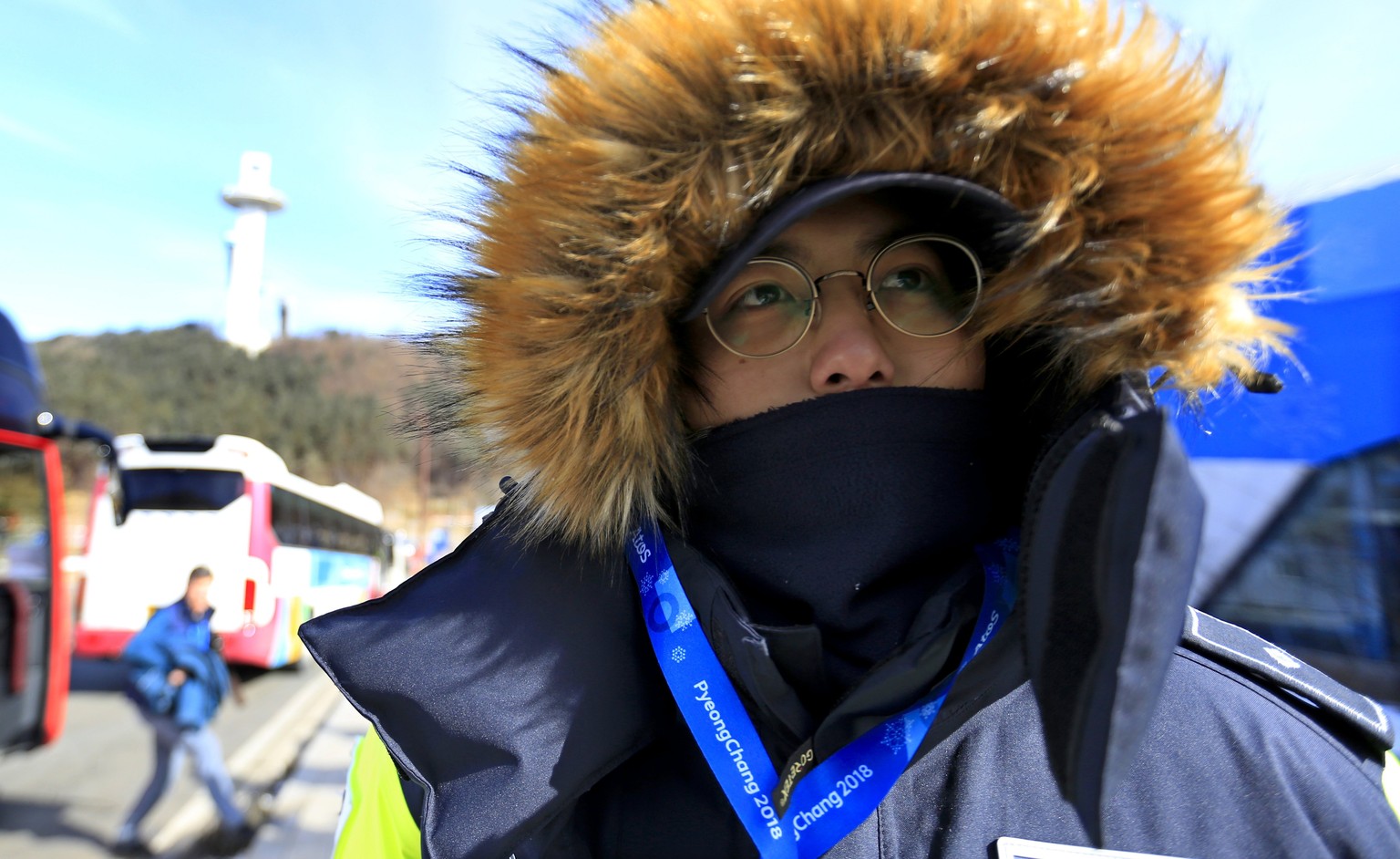 epa06501821 A policeman stands guard rugged up against the cold outside Alpensia resort, the host of several competition venues in the PyeongChang Winter Olympic Games 2018 on 07 February 2018. The Py ...