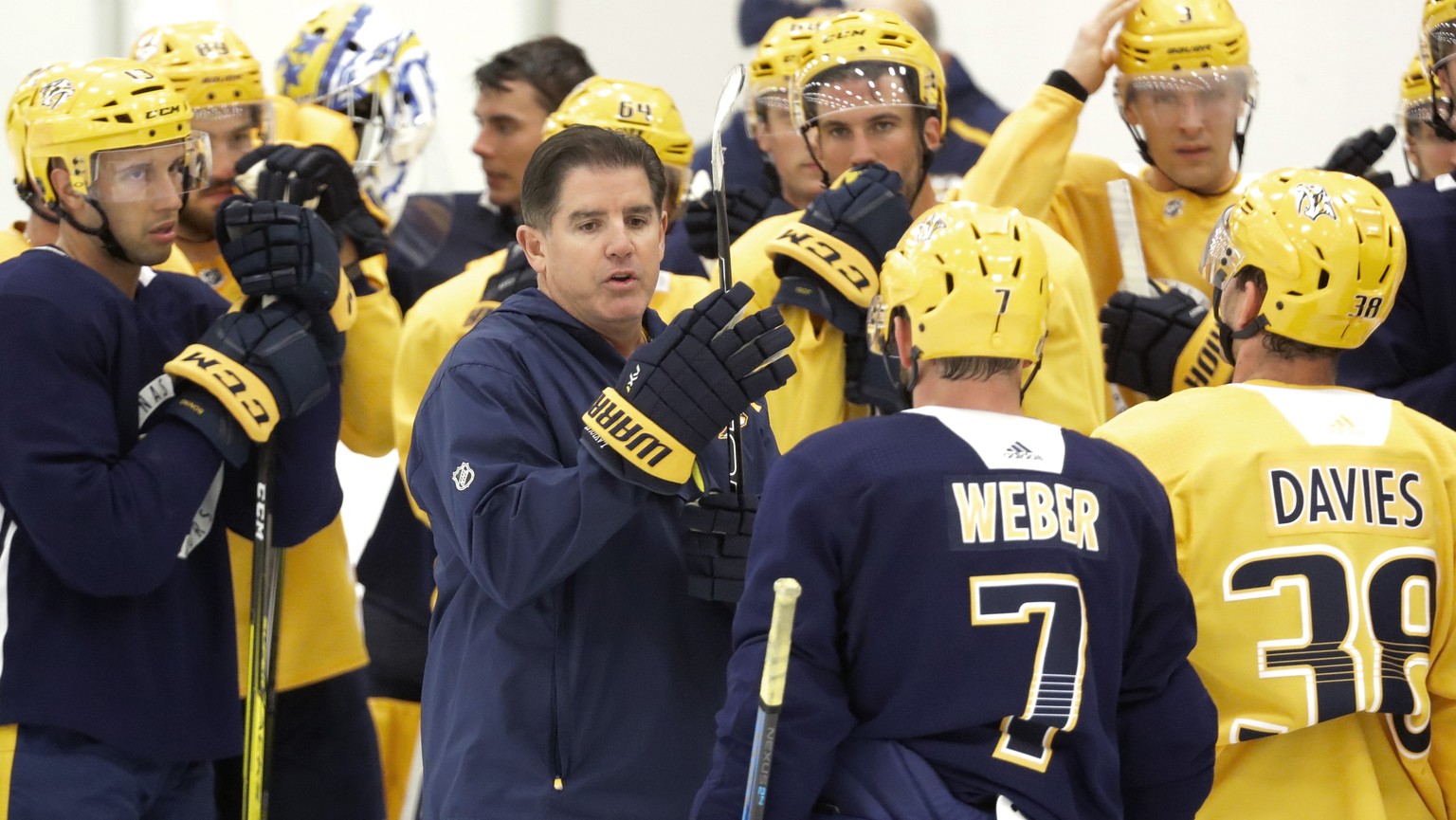 Nashville Predators head coach Peter Laviolette, center, speaks with players during NHL hockey training camp Saturday, Sept. 14, 2019, in Nashville, Tenn. (AP Photo/Mark Humphrey)
Peter Laviolette