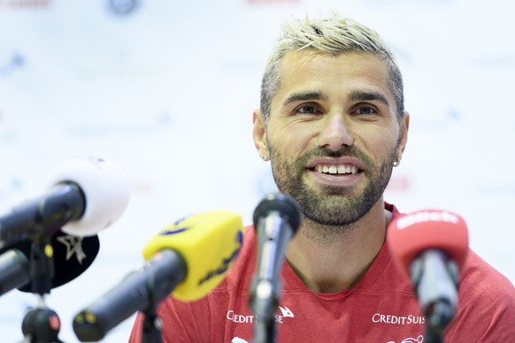 Switzerland&#039;s midfielder Valon Behrami speaks during a press conference after a training session of the Switzerland&#039;s national soccer team at the Torpedo Stadium, in Togliatti, Russia, Wedne ...