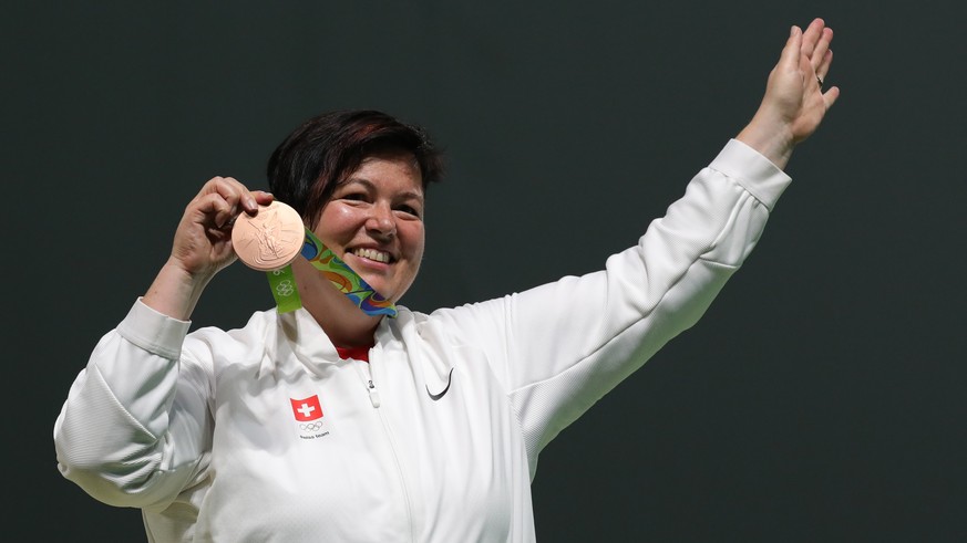 Heidi Diethelm Gerber of Switzerland poses with her bronze medal on the podium of the women&#039;s 25m Pistol competition of the Rio 2016 Olympic Games Shooting events at the Olympic Shooting Centre i ...