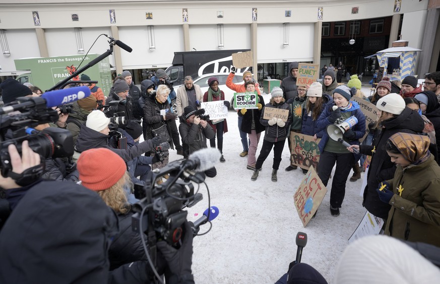 Climate activist Greta Thunberg of Sweden, Vanessa Nakate of Uganda, Helena Gualinga of Ecuador and Luisa Neubauer of Germany, are filmed by the media among other activists at a climate protest outsid ...