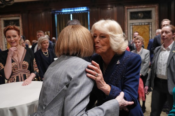Queen Camilla, right, embraces Global Editorial Director of Vogue Anna Wintour during a visit to the New York Public Library for a literacy event Wednesday, April 29, 2026, in New York. (AP Photo/Ryan ...