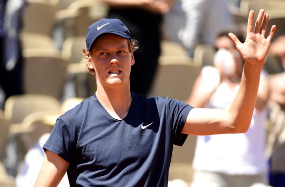 epa09238846 Jannik Sinner of Italy celebrates after defeating Pierre-Hugues Herbert of France in their first round match at the French Open tennis tournament at Roland Garros in Paris, France, 31 May  ...