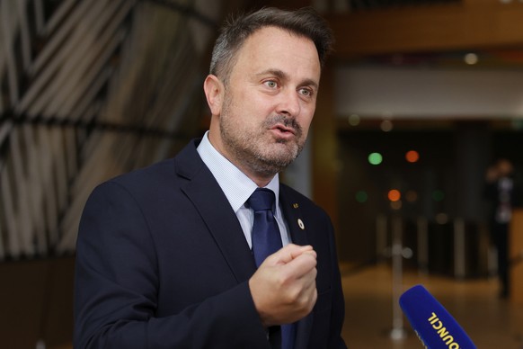 FILE - In this file photo dated Friday, June 25, 2021, Luxembourg&#039;s Prime Minister Xavier Bettel, faces the media as he arrives for an EU summit at the European Council building in Brussels. The  ...