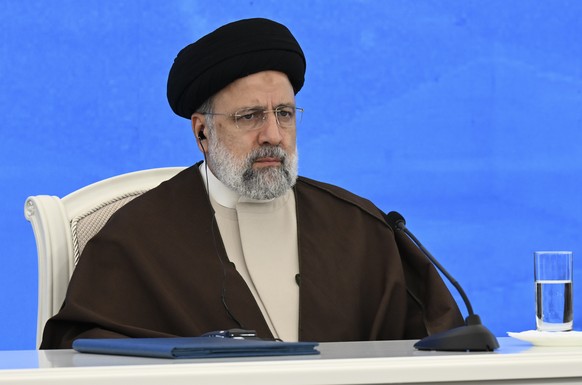 epa11355031 Iranian President Ebrahim Raisi attends an inauguration ceremony of the joint Iran-Azerbaijan-constructed Qiz-Qalasi dam on the Aras River, at the Iran-Azerbaijan border in north-western I ...