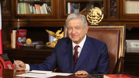 epa08964670 A handout photo made available by the Presidency of Mexico shows Mexican president Andres Manuel Lopez Obrador during his conversation with the president of Russia Vladimir Putin, at the N ...