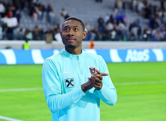 epa12528423 David Alaba of Austria celebrates in front of fans after the team won the FIFA World Cup 26 UEFA qualifier between Cyprus and Austria in Limassol, Cyprus, 15 November 2025. EPA/MARIOS GREG ...