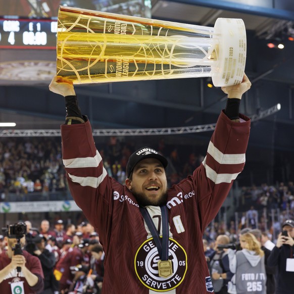 Geneve-Servette&#039;s defender Henrik Toemmernes celebrates with the trophy of Swiss Champion after winning by 4:1 the seventh and final leg of the ice hockey National League Swiss Championship final ...