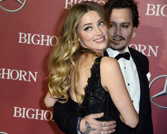 epa08792639 (FILE) - US actress Amber Heard (L) and husband US actor Johnny Depp (R) arrive for the 27th Palm Springs International Film Festival in Palm Springs, California, USA 02 January 2016 (reis ...