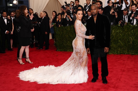 Kim Kardashian, left, and Kanye West arrive at The Metropolitan Museum of Art&#039;s Costume Institute benefit gala celebrating &quot;China: Through the Looking Glass&quot; on Monday, May 4, 2015, in  ...