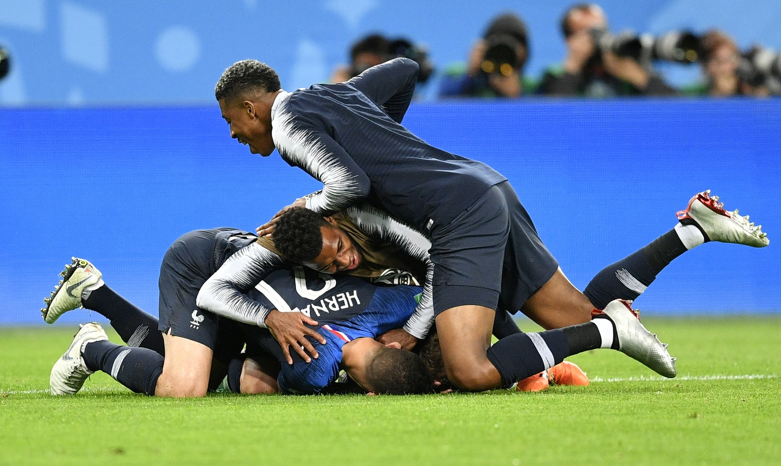 French players celebrate after advancing to the final during the semifinal match between France and Belgium at the 2018 soccer World Cup in the St. Petersburg Stadium in St. Petersburg, Russia, Tuesda ...