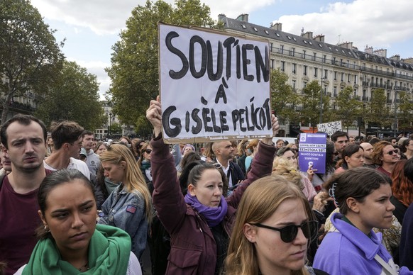 People take part in a gathering in support of 71-year-old Gisele Pelicot who was allegedly drugged by her ex-husband and raped by dozens of men while unconscious, Saturday, Sept. 14, 2024 in Paris. Pl ...